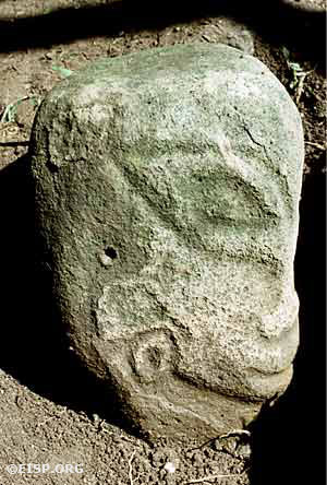 Monolith number 10 (total height 42.3 cm) was excavated on property belonging to the Omenckngkar family at Melekeok and is called by the name of a god, Mengachui. It is an example of figure type variety B5. Photo by David C. Ochsner, ©1987 Jo Anne Van Tilburg.