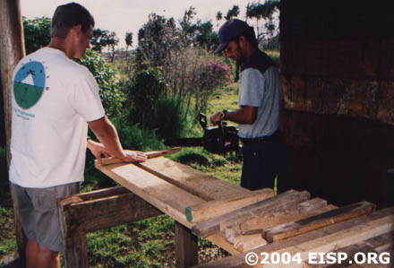 Cristian and Matt cutting stakes used to mark datum points. © EISP 2004.