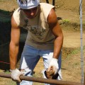 Patricio Rodrigo Madariago Paoa working on setting up scaffolding in preparation for conservation studies and treatment.