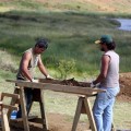 Patricio Rodrigo Madariaga Paoa and Benjamin Mihaore Pakarati González screening excavation deposits.