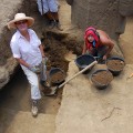 Jo Anne Van Tilburg and Felipe Rubio Munita excavating statue RR-001-156.