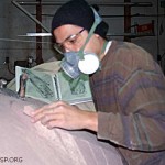 Rapa Nui artist Santi Hito using EISP field data to shape fiberglass foam into our replica average moai. ©1998 EISP/JVT/Photo: J. Van Tilburg.